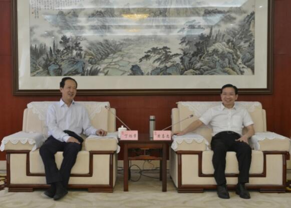 丁焰章拜會南昌市委副書記、市長黃喜忠